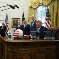 U.S. President Donald Trump speaks during a meeting with FIFA president Gianni Infantino and United States Soccer Federation Carlos Cordeiro in the Oval Office on Tuesday. Facing question of intent, news organizations hesitate to use 'lie' for Trump's misstatements