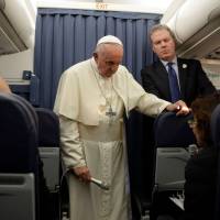 Pope Francis, flanked by head of the Vatican press office, Greg Burke, addresses a reporter during a press conference in flight while returning from Ireland to The Vatican at the end of his two-day visit to Ireland on Sunday. Pope Francis “begged for God’s forgiveness” for multiple abuse scandals within the Irish church but faced accusations by a former Vatican official that he had personally ignored allegations against senior clergy. Pope on claims from former Vatican official: 'I won't say a word about it'