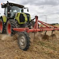 A farmer drives a tractor in his field near Bouloire in north-western France on Aug. 21, after a harvest was weakened by a recent heat wave. The heat, which swept across much of northern Europe this summer, has caused reductions in wheat output in France — the EU’s top producer of the crop — cutting estimates by some 2 million tons from last years figures. China's growing hunger for wheat pushes global reserves to crisis levels, as heat waves and droughts hit harvests
