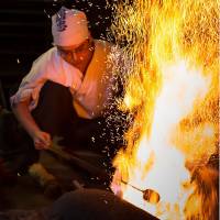 Fire work with me: A man works on a blade in the Osaka prefectural city of Sakai. Staying razor sharp: At the sharp end of Sakai's handmade knife industry