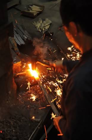 A man works on a blade in Osaka