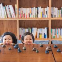 Kids play with Mizuiro Inc.’s Musumusu Animal Poop Clay. From balancing games to playing with poop