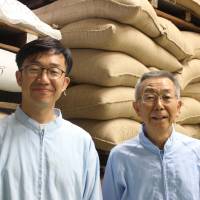 Takehiro Wada (left) with his father Etsuji, the current master roaster at Wadaman. When it comes to high-quality sesame, the roaster is key