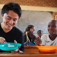 A table for two: Masa Kogure at one of his organization’s projects in Rwanda. Turning the table on global food inequality