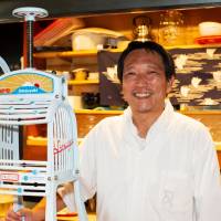 Daily grind: Himitsudo’s owner, former kabuki actor Koji Morinishi, poses by his shop’s hand-powered ice shaver. <I>Kakigōri</I>: Once a child's treat, now a luxury dessert