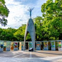 Left: The Children’s Peace Monument, topped by the figure of Sadako Sasaki, is surrounded by paper cranes donated to Hiroshima’s Peace Memorial Park from around the world. The nine booths surrounding the monument were installed by the city in 2002 to protect the cranes. 60 years after Sadako Sasaki's death, the story behind Hiroshima's paper cranes is still unfolding