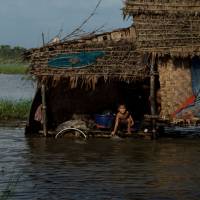 A child bathes Wednesday in the Irrawaddy, Myanmar’s longest river fed by waters from Tibetan springs and Himalayan glaciers. A global environmental threat made in China