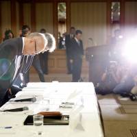 National disgrace: Tetsuo Yukioka, managing director of Tokyo Medical University, and Keisuke Miyazawa, its vice president, bow in apology at a news conference about exam-fixing in Tokyo on Aug. 7. Tokyo Medical University scandal is a throwback to when discrimination against women was the norm