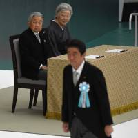 Emperor Akihito and Empress Michiko watch as Prime Minister Shinzo Abe walks toward the altar during the annual official memorial service for war victims on Aug. 15 in Tokyo. The Emperor is due to abdicate next April 30, which will bring an end to the Heisei Era. Lessons from the 30 years of the Heisei Era