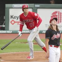 Shohei Ohtani watches his two-run homer against Cleveland leave the yard in the first inning on Friday. Shohei Ohtani hits two homers, goes 4-for-5 as Angels top Indians