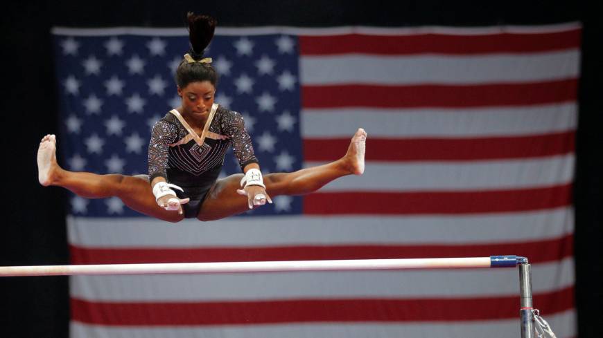 Simone Biles competes on the uneven bars at the U.S. Gymnastics Championships in Boston on Friday. Simone Biles remains a cut above