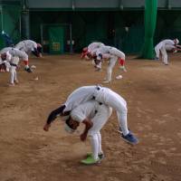 Chiben Wakayama players stretch during practice. Summer Koshien: From the inside