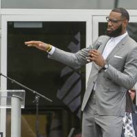 LeBron James speaks during the opening ceremony for the I Promise School on July 30, in Akron, Ohio. Trump takes aim at LeBron; Michael Jordan, other athletes respond