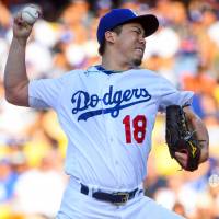 Dodgers starter Kenta Maeda pitches against the Astros during the first inning on Saturday at Dodger Stadium. Astros cruise past Maeda, Dodgers