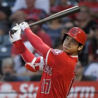 Los Angeles’ Shohei Ohtani hits a three-run home run during the first inning of the Angels’ 11-5 win over the Tigers on Tuesday. Shohei Ohtani hits home run as Angels beat Tigers