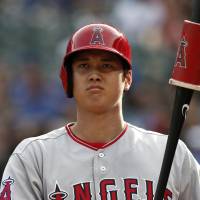 Angels designated hitter Shohei Ohtani prepares to bat against the Texas Rangers on Aug. 19 in Arlington, Texas. Shohei Ohtani confident he will return to mound this season