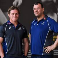 Australia captain Michael Hooper (left) poses with coach Michael Cheika after a news conference on Friday in Sydney. Australia captain Michael Hooper cleared for first Bledisloe Cup test