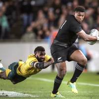 Australia’s Marika Koroibete (left) tackles New Zealand’s Waisake Naholo during their Aug. 25 Bledisloe Cup game at Auckland’s Eden Park. JRFU still confident of big crowd for Bledisloe Cup dead rubber in Yokohama