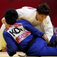 Ruika Sato competes in the women’s 78-kg gold-medal contest against South Korea’s Park Yu-jin on Friday in Jakarta. Judoka Ruika Sato, Kentaro Iida, Akira Sone add to Japan's gold-medal haul