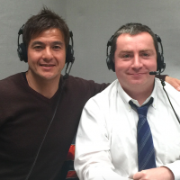 John Gunning and fellow NHK English-language sumo commentator Hiro Morita pose before a March 2015 broadcast. English sumo broadcasts bring together diverse cast