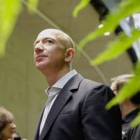 CEO Jeff Bezos tours the Amazon Spheres facility at its grand opening in Seattle on Jan. 29. Amazon briefly becomes second U.S. company to reach $1 trillion market value