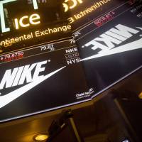 A monitor displays Nike Inc. signage on the floor of the New York Stock Exchange (NYSE) in New York on Tuesday. More big-name firms embroiled in recent U.S. political debates, inviting Trump's wrath