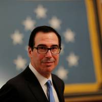 U.S. Treasury Secretary Steven Mnuchin arrives at a White House reception for Congressional Medal of Honor recipients in the East Room of the White House in Washington Wednesday. U.S. blacklists North Korean-controlled IT firms in China, Russia