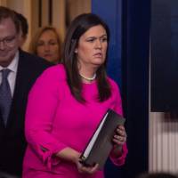 White House spokeswoman Sarah Huckabee Sanders and Kevin Hassett, chairman of the Council of Economic Advisers, arrive at a briefing at the White House in Washoington Monday. As midterm polls approach, Trump insists booming U.S. economy is not Obama's
