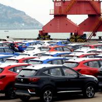 SUVs waiting to be exported are seen at a port in Lianyungang, in China’s Jiangsu province, in April. White House optimistic on Chinese trade issues