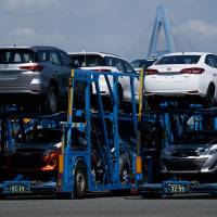 Toyota Motor Corp. vehicles are seen in car carrier trailers at Nagoya Port on July 31. Japan’s exports rose 6.6 percent in August from a year earlier. Japan exports rise on growing U.S.-bound shipments amid trade war fears