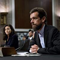 Jack Dorsey, co-founder and chief executive officer of Twitter Inc., speaks as Sheryl Sandberg, chief operating officer of Facebook Inc., llistens during a Senate Intelligence Committee hearing in Washington on Wednesday. Lawmakers from both sides of the aisle have increased pressure on technology companies on Russian interference in the 2016 presidential campaign and other election meddling as well as issues including alleged anti-conservative bias and antitrust questions. Facebook, Twitter on defense in U.S. Congress over foreign bids to tilt polls, politics