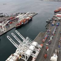 Cargo cranes are seen in February at the Port of Seattle in Seattle. The path to peace in a trade war between the United States and China is getting harder to find as the world’s two biggest economies pile ever more taxes on each other’s products. Trump's tariffs could sow trouble for GOP candidates in farm districts
