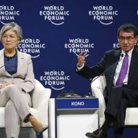 Foreign Minister Taro Kono (right) speaks at the World Economic Forum in Hanoi Thursday as South Korean Foreign Minister Kang Kyung-wha looks on. Foreign Minister Taro Kono tells World Economic Forum that Japan is ready to accept more workers from abroad