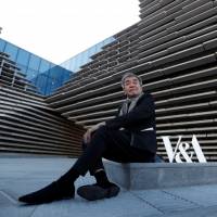 Architect Kengo Kuma sits outside the V & A musuem in Dundee, Scotland, Wednesday. Olympic stadium architect Kengo Kuma unveils futuristic museum in Scotland