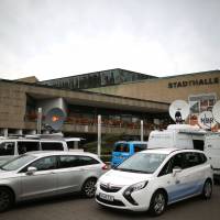 News vans are parked Monday outside the Stadthalle venue in Braunschweig, northern Germany, on the first day of the model case proceedings in Germany against German carmaker Volkswagen (VW) over its cheating in emissions tests involving millions of diesel cars. The first major German court case against Volkswagen over the “dieselgate” scandal that has shaken up the car industry gets underway, as investors pursue the world’s largest automaker for billions in compensation. VW faces first big German court date over 'dieselgate' as investors pursue redress for losses