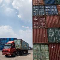 A truck transports containers last month at a port in Zhangjiagang in China’s eastern Jiangsu province. 'Urgent need' to reform WTO, G20 trade ministers say