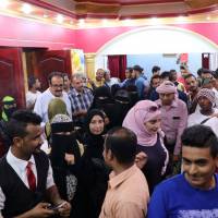 People crowd outside a wedding hall where the local movie “Ten Days Before the Wedding” is being played in Aden Saturday. Yemenis find solace in cinema after years of war in flick about their plight