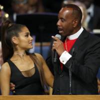 Bishop Charles H. Ellis III speaks with Ariana Grande after she performed during the funeral service for Aretha Franklin at Greater Grace Temple in Detroit on Friday. Bishop apologizes to Ariana Grande for joke and how he touched her onstage during Aretha Franklin's funeral