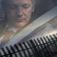 WikiLeaks founder Julian Assange arrives at Belmarsh Magistrate’s court in London for an extradition hearing in January 2011. Trove of documents shows WikiLeaks' Julian Assange sought Russian visa in 2010
