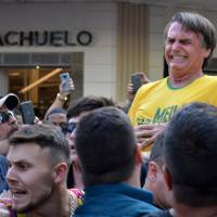 Brazilian presidential candidate Jair Bolsonaro reacts after being stabbed during a rally in Juiz de Fora, Minas Gerais state, Brazil, Sept. 6. Stabbed Brazilian presidential candidate needs another 'big' operation
