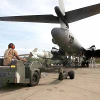 A U.S. Air Force weapons loader delivers a 2,000-oiybd bomb for loading into a B1 bomber at the Diego Garcia base in 2001. International judges will hear arguments on Monday to examine the fate of the Brit.ish-ruled Chagos Islands, home to a strategic joint U.S military base — now claimed by Mauritius. In a diplomatic blow to Britain last year, the United Nations adopted a resolution presented by Mauritius and backed by African countries, asking the International Court of Justice to offer an advisory opinion on the island chain’s fate. World Court weighs U.K. claim to Chagos Islands, site of key U.S. base, in Indian Ocean