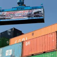 A container is loaded onto the first Chinese container ship to depart after the inauguration of the China Pakistan Economic Corridor port in Gwadar, Pakistan, on Thursday. High debt limits China's range of weapons in defending against Trump's tariff blitz