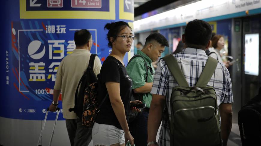 Ren Liping waits for a subway train as she prepares to file her petition with police headquarters after arriving at the south train station in Beijing on July 3. As #MeToo unnerves China, a student fights to tell her story