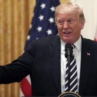 President Donald Trump speaks during a news conference with Polish President Andrzej Duda, in the East Room of the White House Tuesday in Washington. Trump accuses China of election meddling by targeting political base in U.S.-initiated trade war
