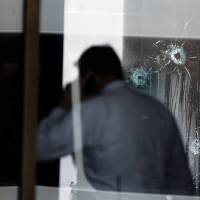 Police investigate the scene after a shooting at the Fifth Third Bank building on Fountain Square Thursday in downtown Cincinnati. 'A horrific situation': High-rise Cincinnati bank shooting leaves four dead