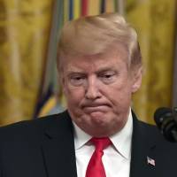 President Donald Trump speaks during a reception in the East Room of the White House in Washington Wednesday. From 'birtherism' to 'deep state,' Puerto Rico death toll joins Trump's conspiracy theory list