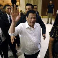The president of the Philippines Rodrigo Roa Duterte waves upon his arrival in Jerusalem at the start of an official visit to Israel, on Sunday. Duterte welcomed in Israel in first visit by a Philippine president, despite Holocaust remarks