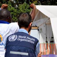 Esperance Nzavaki and health workers celebrate news of her Ebola cure at The Alliance for International Medical Action treatment center in Beni, Congo, on Tuesday. Ebola fight has new science but faces old hurdles in restive Congo