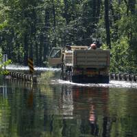 Members of the 1st Combat Engineer Company of the U.S. National Guard of Laurinburg, North Carolina, navigate flood waters in the aftermath of Hurricane Florence, now downgraded to a tropical depression, in Whiteville, North Carolina, Tuesday. 'Nightmare that won't end': Evacuees in limbo after Hurricane Florence dumped meter of rain, killed at least 35