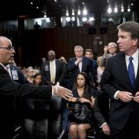 Fred Guttenberg, the father of Jamie Guttenberg, who was killed in the Stoneman Douglas High School shooting in Parkland, Florica, attempts to shake hands with President Donald Trump’s Supreme Court nominee, Brett Kavanaugh, as he leaves for a lunch break while appearing before the Senate Judiciary Committee on Capitol Hill in Washington Tuesday to begin his confirmation to replace retired Justice Anthony Kennedy. Kavanaugh did not shake his hand. Trump Justice pick Brett Kavanaugh turns away as Parkland shooting victim's dad tries to shake his hand